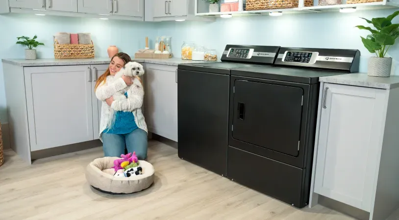 speed-queen-matte-black-top-load-laundry-woman-hugging-dog